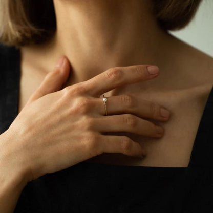 Minimalist gold ring with solitaire pearl