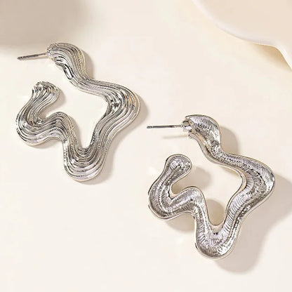 Sculptural wave statement earrings