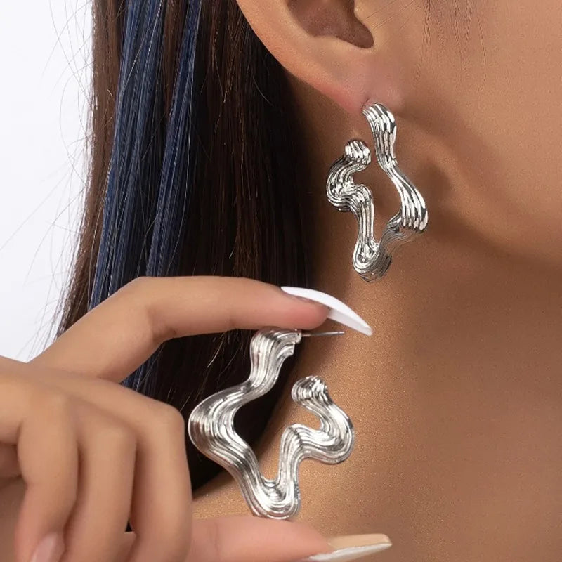 Sculptural wave statement earrings