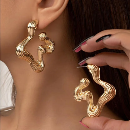 Sculptural wave statement earrings