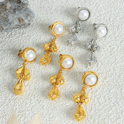 Pearl stud earrings with textured teardrop pendants