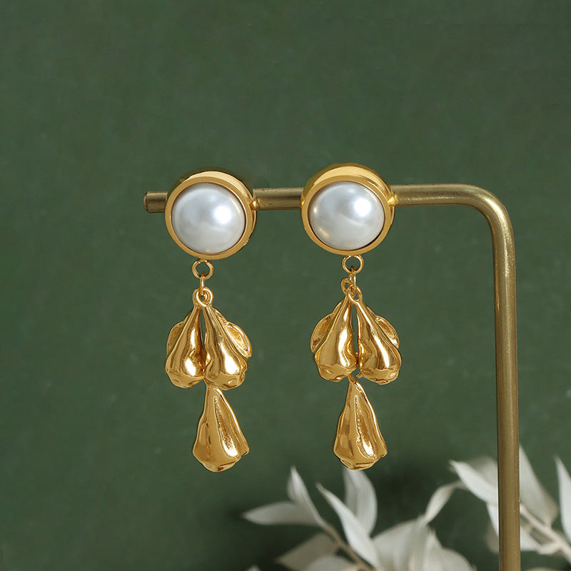 Pearl stud earrings with textured teardrop pendants