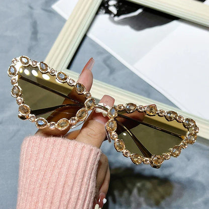 Heart-shaped sunglasses with gemstone embellishments