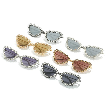 Heart-shaped sunglasses with gemstone embellishments