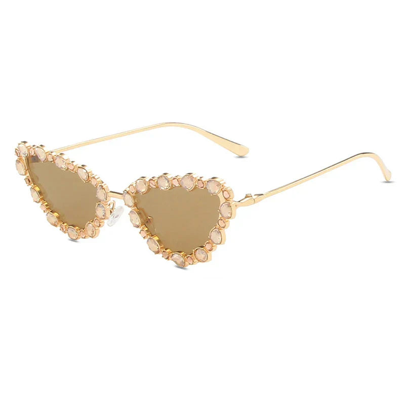 Heart-shaped sunglasses with gemstone embellishments