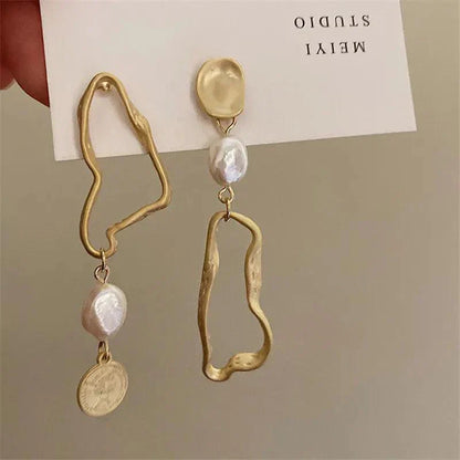 Asymmetric baroque pearl earrings with gold accents