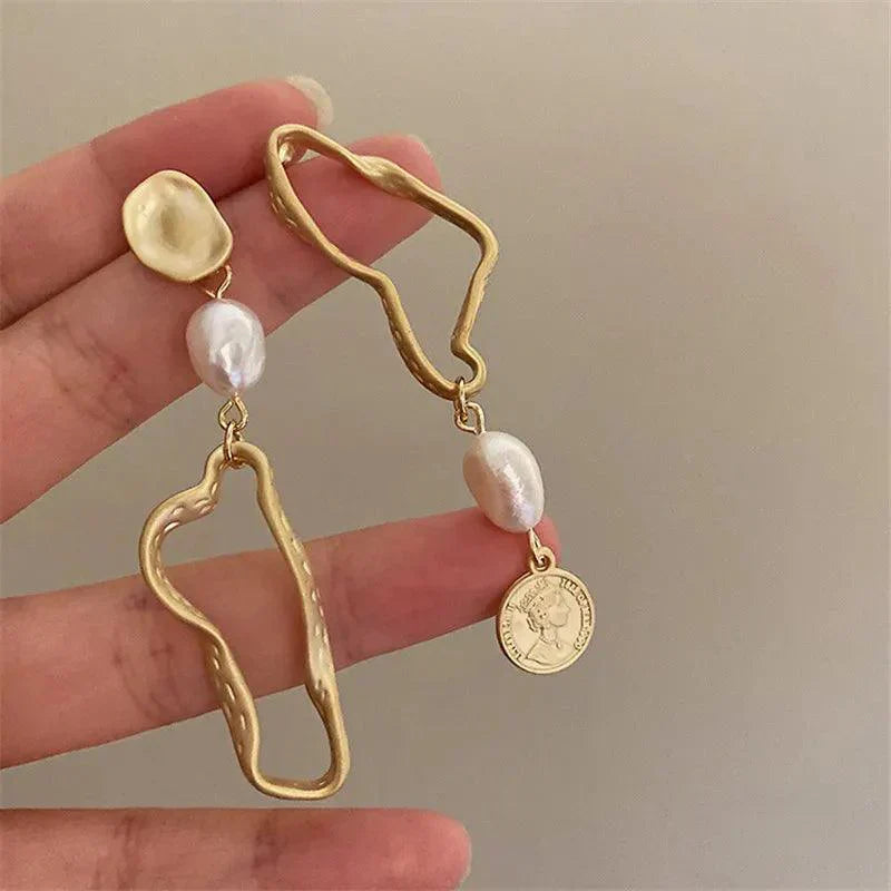 Asymmetric baroque pearl earrings with gold accents