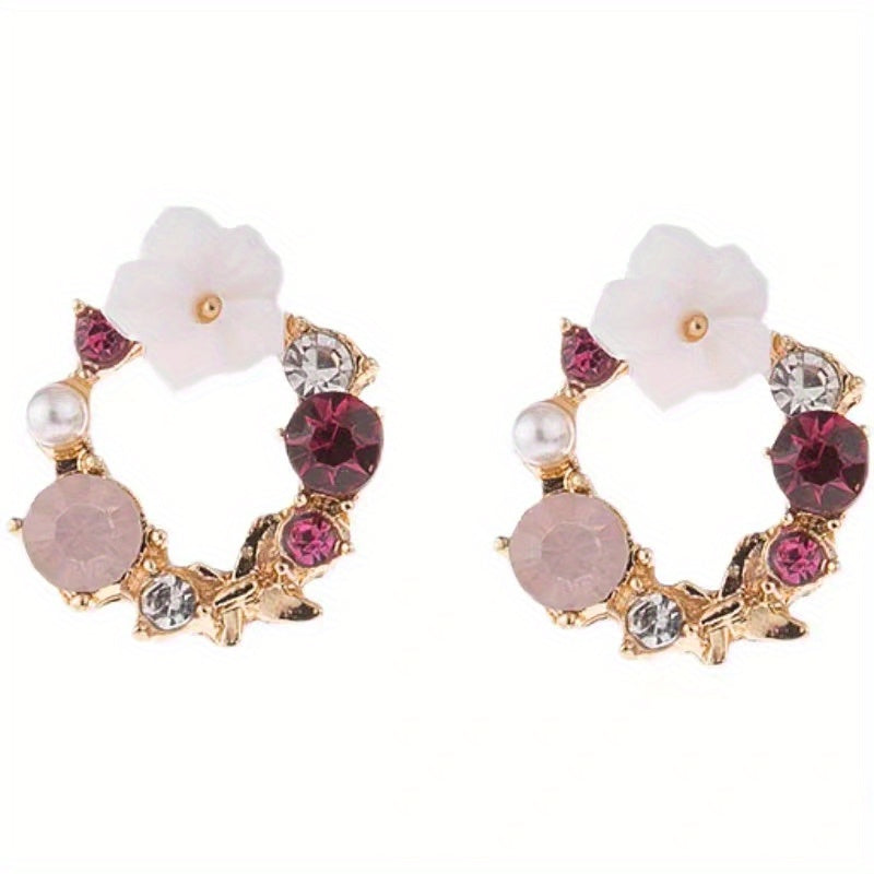 Stud earrings with floral motif and gemstone accents